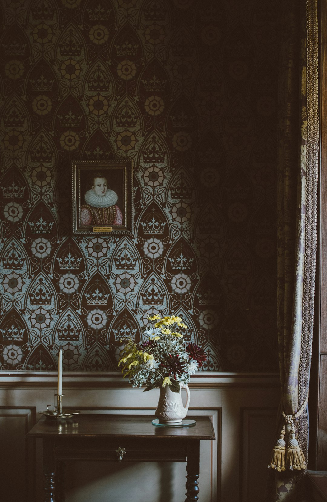 painting hanged on wall over flower arrangement on console table painting hanged on wall over flower arrangement on console table