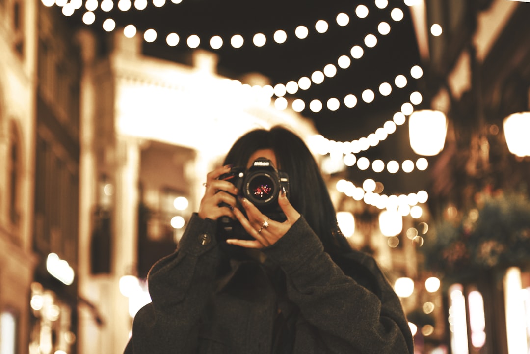 a person holding a camera a person holding a camera